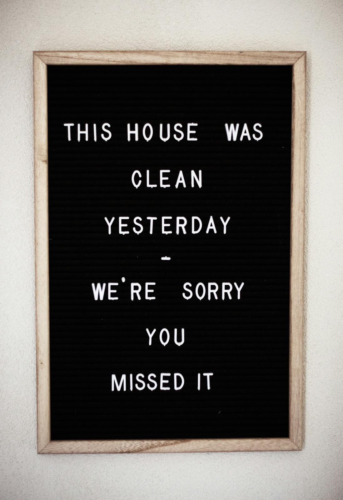Black letterboard sign reading: This house was clean yesterday — we're sorry you missed it